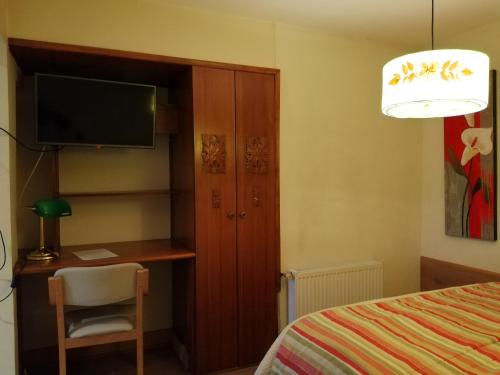 Cama o camas de una habitación en Posada Selva Negra