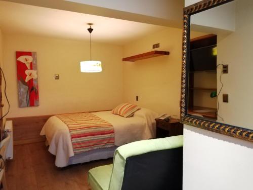 Cama o camas de una habitación en Posada Selva Negra