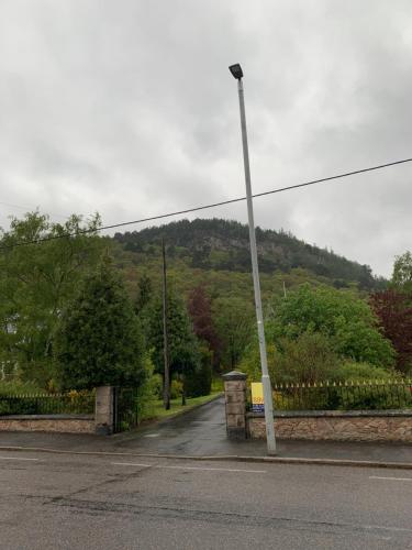 a street light on the side of a road at The Auld Kirk in Ballater