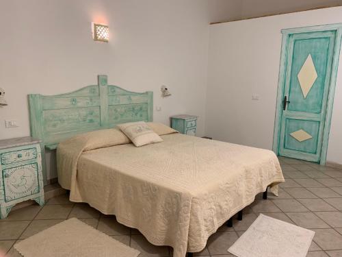 Tempat tidur dalam kamar di Canne al Vento
