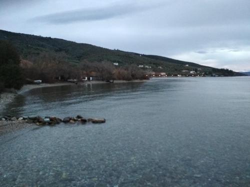 a large body of water with rocks in it at Kalama Apartments in Kálamos