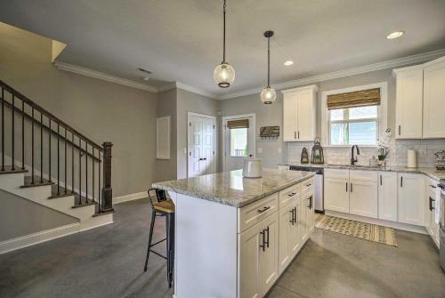 a kitchen with white cabinets and a counter top at Downtown Retreat in Chattanooga