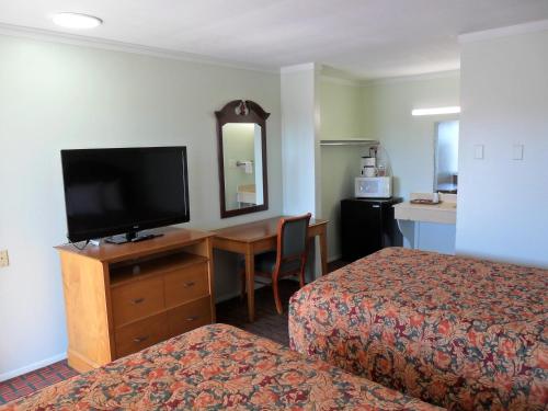 Ένα ή περισσότερα κρεβάτια σε δωμάτιο στο A-OK Motel