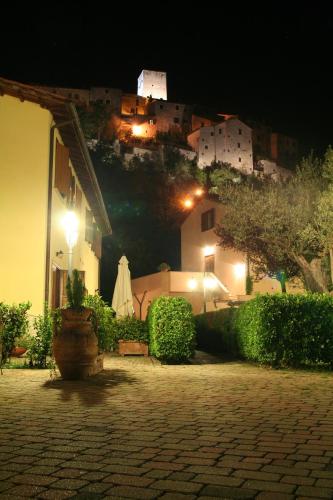 a view of a house at night with a town at Case Vacanza Fiocchi in Arrone