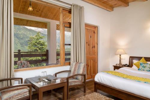 A bed or beds in a room at Hotel Delfryn