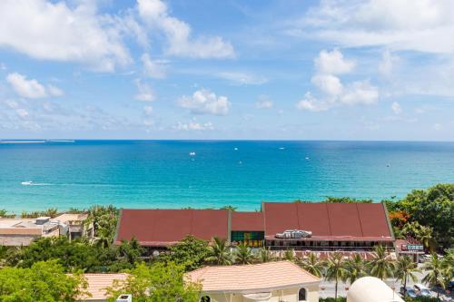 a view of the ocean from a resort at Sanya Sun Seaview Apartment in Sanya