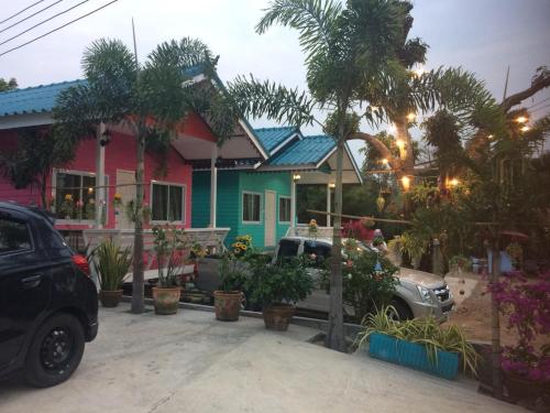 a house with a truck parked in front of it at Bannrommai Sattahip in Sattahip