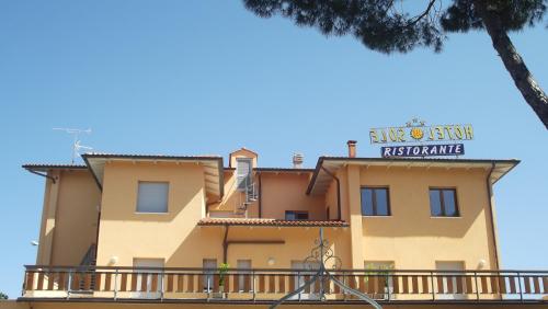 a building with a sign on top of it at Villa Hotel Del Sole in Chiusi