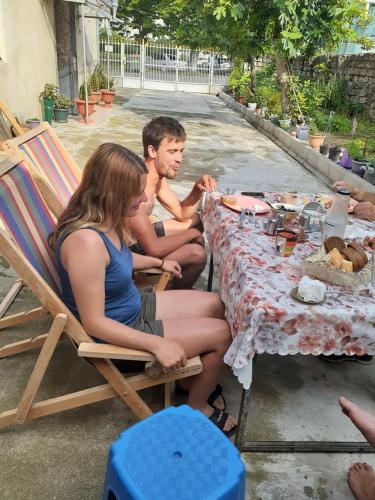 a group of people sitting at a table at Boutique hotel in Poti