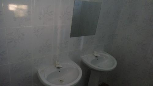 a bathroom with a sink and a toilet at JJ & JE Family House in Dar es Salaam