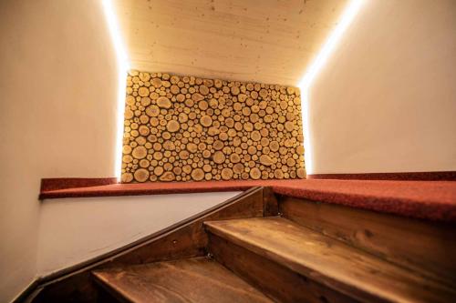 a set of stairs in a room with a wall at Ansitz Hofer in Fulpmes