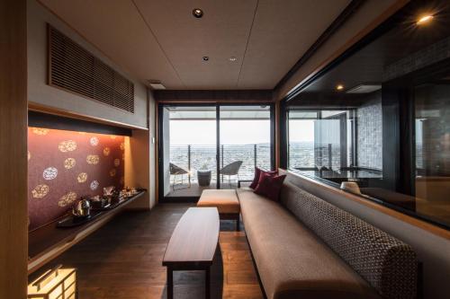 a living room with a couch and a table at Shoho in Matsumoto