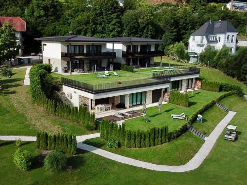 an aerial view of a house with a garden at Linde Villas in Maria Wörth