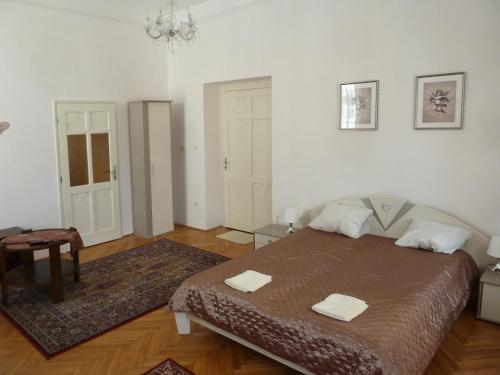 A bed or beds in a room at Central Apartment