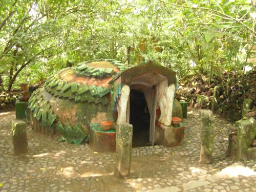 a small building in the middle of a forest at Reserva Ecologica Nanciyaga in Catemaco
