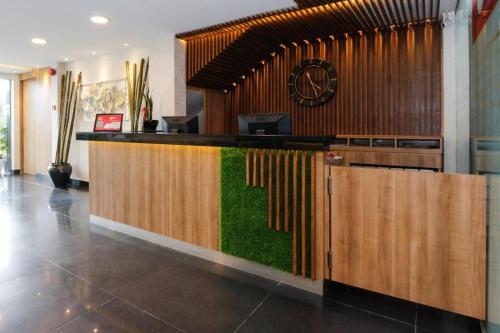 a lobby with a bar with grass on it at My Hotel @ KL Sentral in Kuala Lumpur