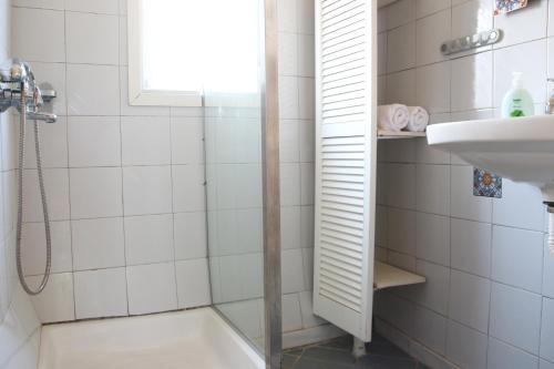 a bathroom with a shower and a sink at house in the village near the sea in Maleme
