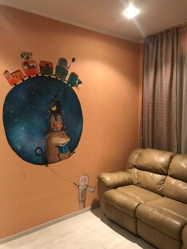 a room with a wall with a painting of a snowman at DAUGAVPILS in Daugavpils
