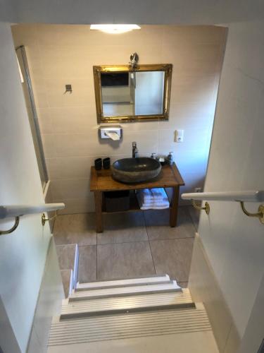 a bathroom with a sink and a mirror at Fenix Hall Boutique Hotel Hallstatt in Hallstatt