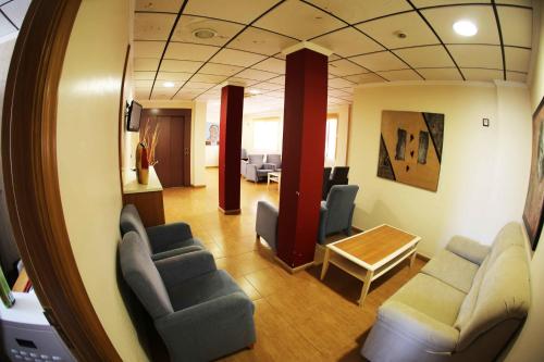 a room with chairs and a table in a room at Venta de Tébar in Águilas