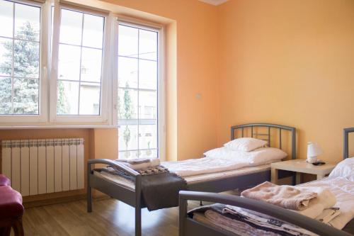 Ένα ή περισσότερα κρεβάτια σε δωμάτιο στο Magic Garden Hostel