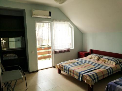 Postel nebo postele na pokoji v ubytování Villa Vachnadze