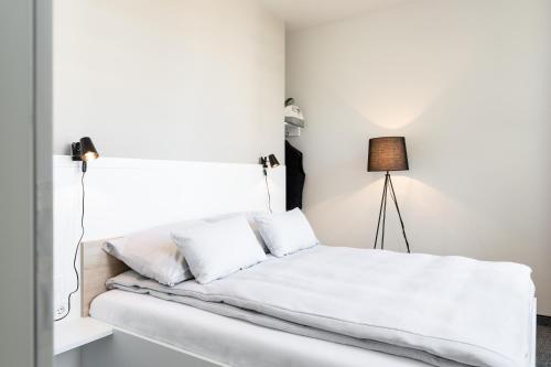 Postel nebo postele na pokoji v ubytování HUB Apartments