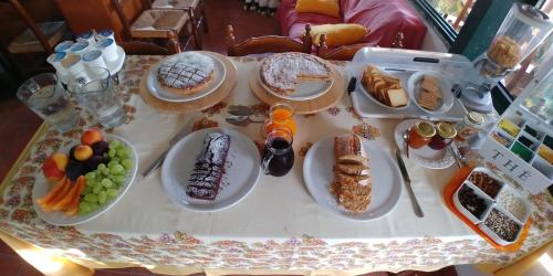 a table with plates of food on a table at La Piana degli Ulivi in Rossano