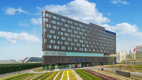 a rendering of the entrance to the elkin hotel at Novotel Shanghai Hongqiao in Shanghai