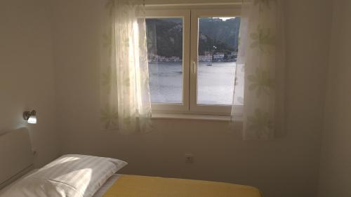 Posteľ alebo postele v izbe v ubytovaní Apartment Zaklopatica