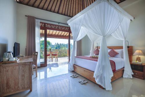 Postel nebo postele na pokoji v ubytování Nata Ubud