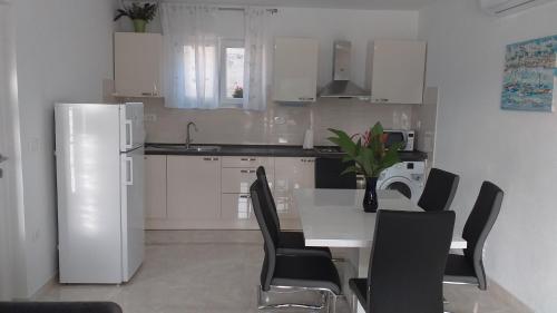Kuchyň nebo kuchyňský kout v ubytování Apartment Zaklopatica