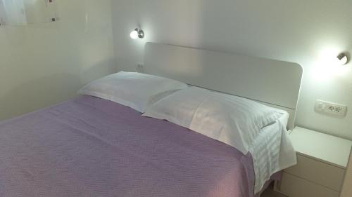 Postel nebo postele na pokoji v ubytování Apartment Zaklopatica