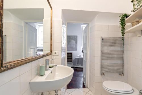 a bathroom with a sink and a toilet at Rome as you feel - Vetrina Terrace in Rome