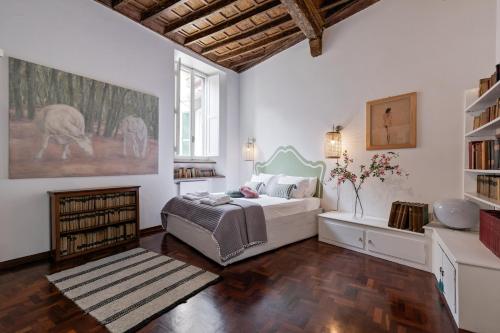 a bedroom with a bed and a book shelf at Rome as you feel - Vetrina Terrace in Rome