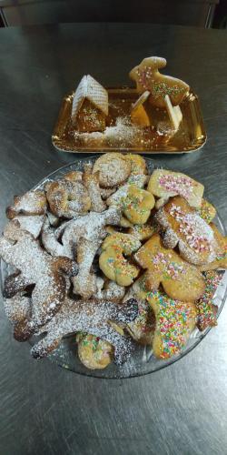 a plate of donuts and a plate of other donuts at La Piana degli Ulivi in Rossano