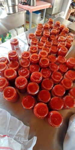 a bunch of red bowls sitting on a table at La Piana degli Ulivi in Rossano