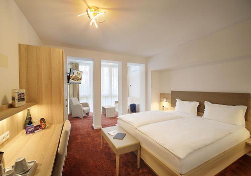 Ліжко або ліжка в номері Hotel Brenner