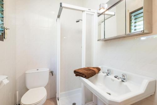 a bathroom with a toilet and a sink and a shower at Ca Na Sioneta in Campanet