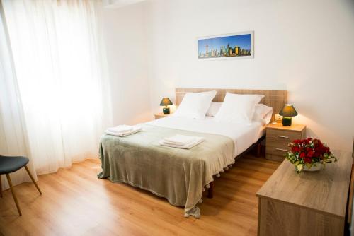 A bed or beds in a room at Casa Mamalola
