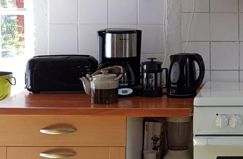 a counter top with a coffee maker on top of it at Les Marronniers in Reillanne