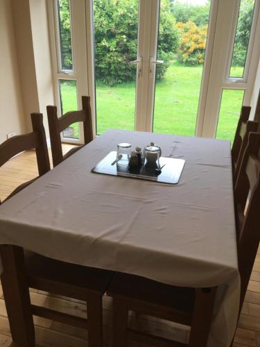 a dining room table with a white table cloth on it at Northorpe in Hornsea