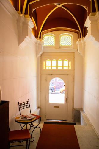 a hallway with a white door and a window at Hotel Stern in Düsseldorf