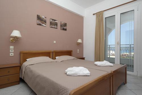 Postel nebo postele na pokoji v ubytování Theodosia Apartments
