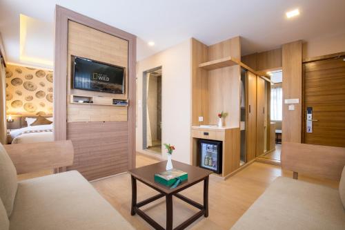a living room with a couch and a fireplace at Boudha Boutique Hotel in Kathmandu