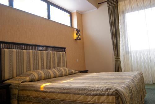 Postel nebo postele na pokoji v ubytování Hotel Tecadra