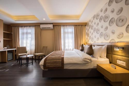Ένα ή περισσότερα κρεβάτια σε δωμάτιο στο Lords Eco Inn Kathmandu