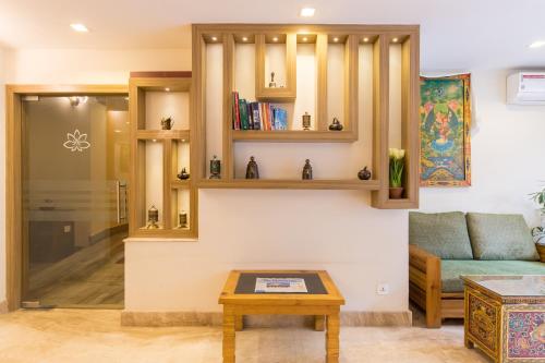 a living room with a couch and a table at Boudha Boutique Hotel in Kathmandu