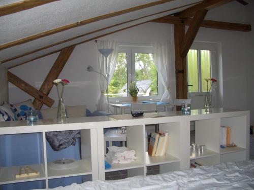 a bedroom with a bed with white shelving at Ferienwohnung Kruppa in Rerik
