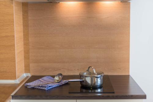 a pot on top of a stove in a kitchen at Balchik Sea View Apartments in Princess Residence in Balchik